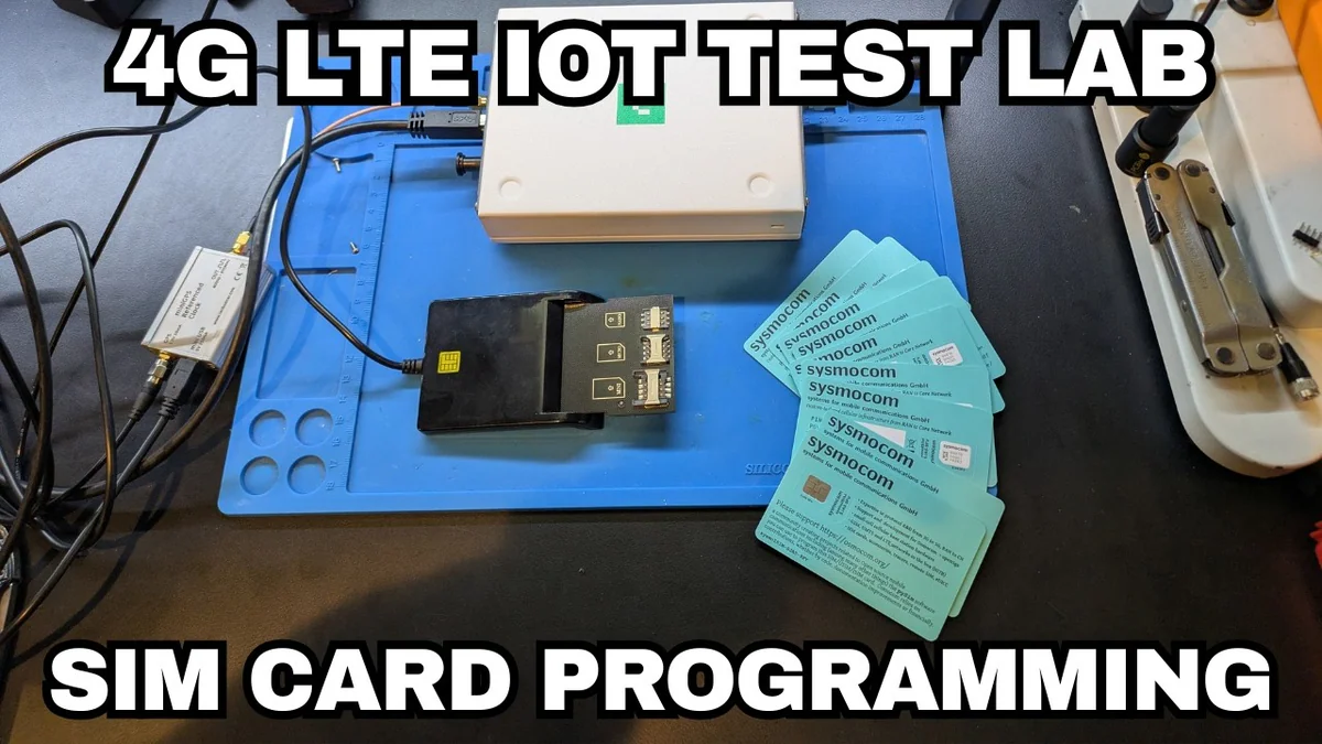4G LTE IoT test lab: USB smart card reader and stack of sysmocom programmable SIMs